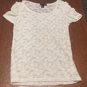 A white see through flower shirt